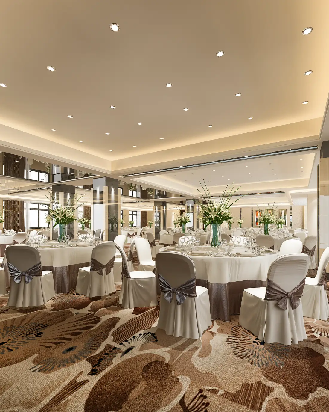 An enclosed hall laid with round tables for an event