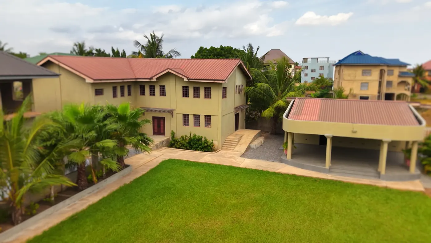 The guest block and the terrace from above, the lawn below them