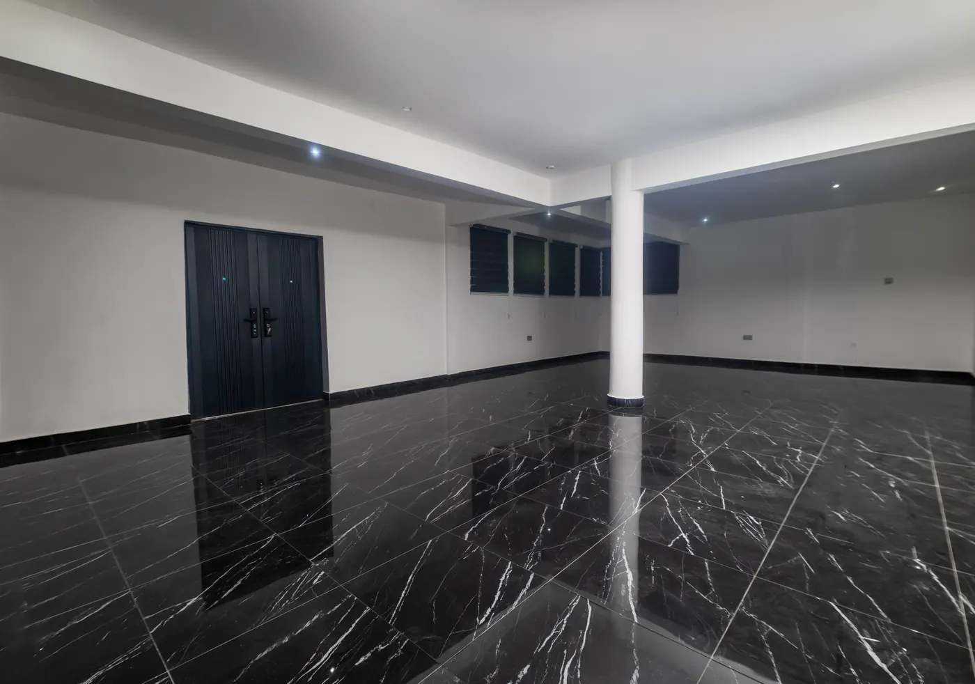 The Executive Hall, a polished dark floor running the width of the room