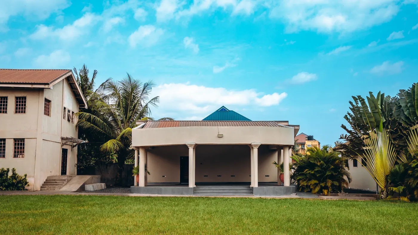 The terrace and the guest block from the middle of the lawn